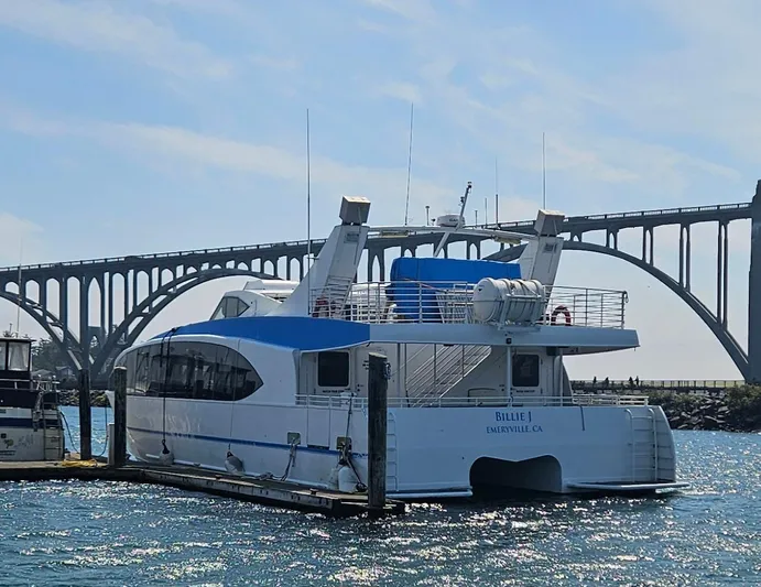 Billie J Yacht Photos Pics High-speed passenger boat docked near a bridge, Custom model, 2008.