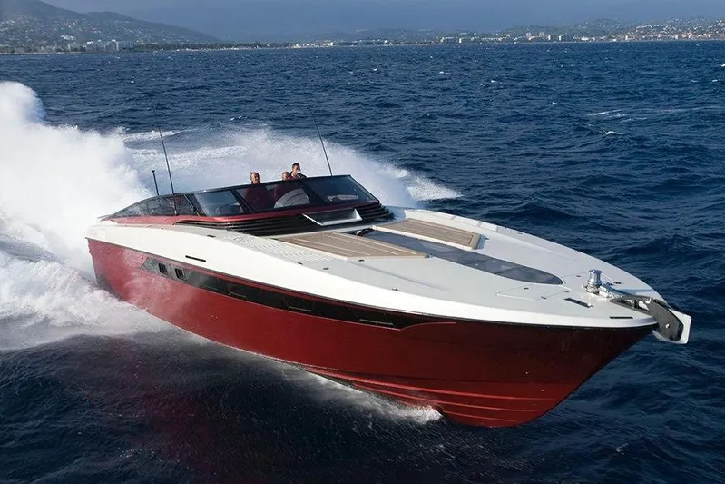  Yacht Photos Pics 2010 Otam 58 Millennium Open yacht cruising on the ocean with scenic coastline backdrop.