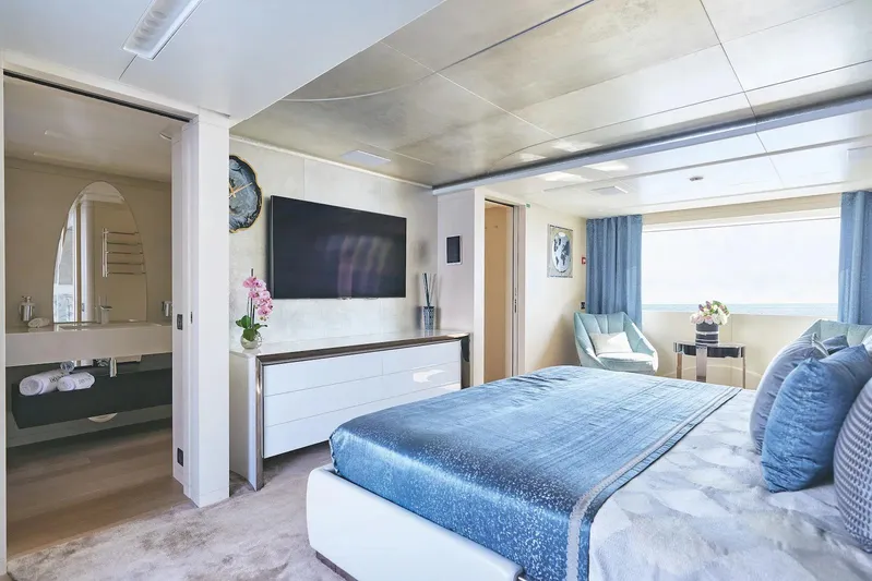  Yacht Photos Pics Luxurious Benetti B.NOW 2022 yacht bedroom with modern decor and ensuite bathroom.