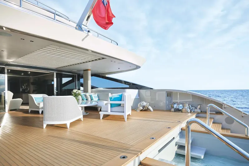  Yacht Photos Pics Luxurious Benetti B.NOW 2022 yacht deck with elegant seating and ocean view.