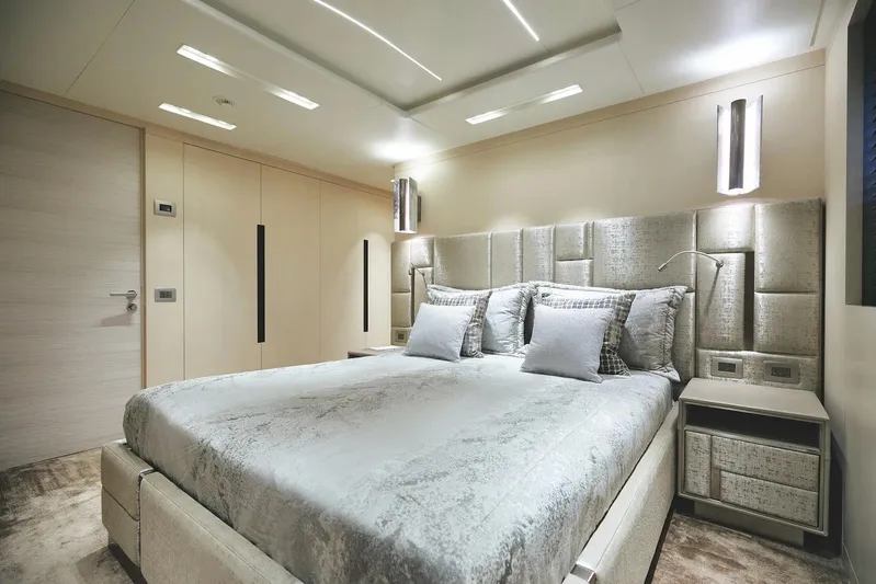  Yacht Photos Pics Luxurious bedroom interior on 2022 Benetti B.NOW yacht, featuring modern design and elegant lighting.