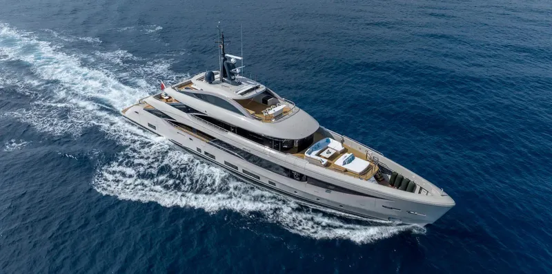  Yacht Photos Pics Luxurious 2022 Benetti B.NOW yacht cruising on open sea, showcasing sleek design and elegance.