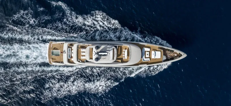 Yacht Photos Pics Aerial view of 2022 Benetti B.NOW yacht cruising on open sea.