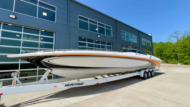  Yacht Photos Pics 2003 Fountain 47 Lightning boat on trailer outside modern building.