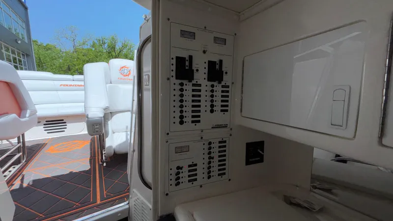  Yacht Photos Pics Interior view of a 2003 Fountain 47 Lightning boat showing control panels and seating area.