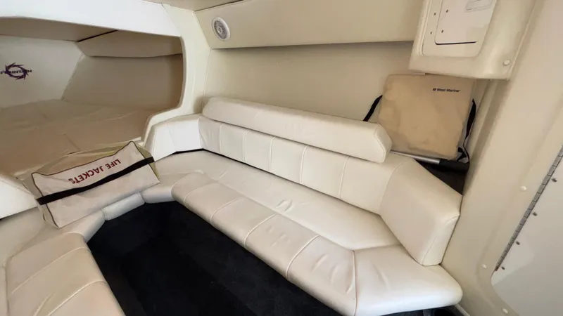  Yacht Photos Pics 2003 Fountain 47 Lightning interior with white leather seating and life jackets.