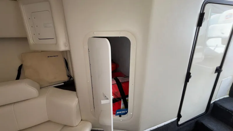  Yacht Photos Pics Interior of 2003 Fountain 47 Lightning boat with storage compartment and seating.