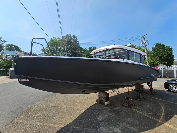  Yacht Photos Pics 2023 XO Boats EXPLR 10 Sport Plus on stands, side view, outdoors.