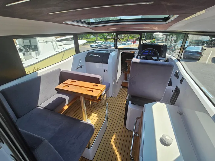  Yacht Photos Pics Interior of 2023 XO Boats EXPLR 10 Sport Plus, featuring seating and helm station.