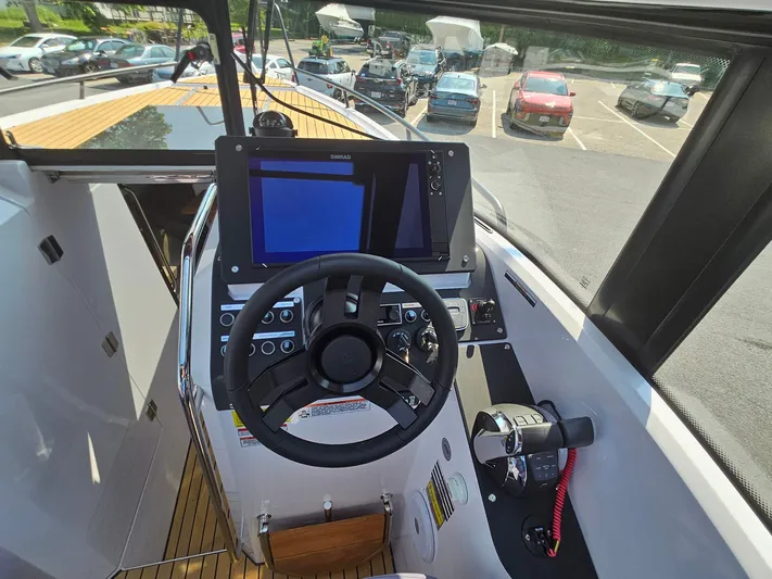  Yacht Photos Pics 2023 XO Boats EXPLR 10 Sport Plus helm with advanced navigation system and controls.