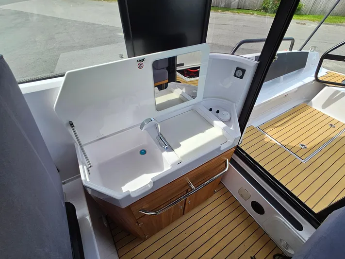  Yacht Photos Pics 2023 XO Boats EXPLR 10 Sport Plus interior sink and counter area.
