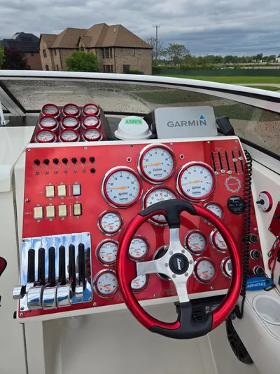  Yacht Photos Pics Control panel of a 2004 Fountain 47 Lightning boat with gauges and Garmin navigation.