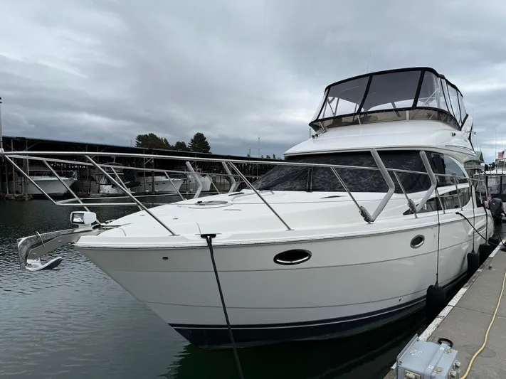  Yacht Photos Pics 2006 Meridian 391 Sedan yacht docked at marina under cloudy sky.