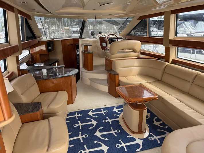  Yacht Photos Pics Luxurious interior of 2006 Meridian 391 Sedan yacht with leather seating and nautical decor.