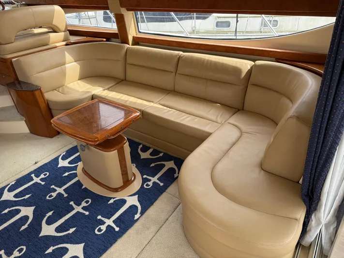  Yacht Photos Pics Luxurious interior of 2006 Meridian 391 Sedan with beige leather seating and nautical decor.