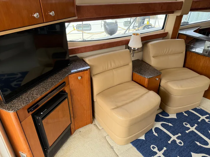 Yacht Photos Pics Luxurious interior of 2006 Meridian 391 Sedan with leather seating and nautical decor.