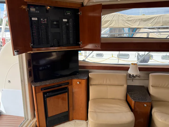  Yacht Photos Pics 2006 Meridian 391 Sedan interior with TV, seating, and control panel.