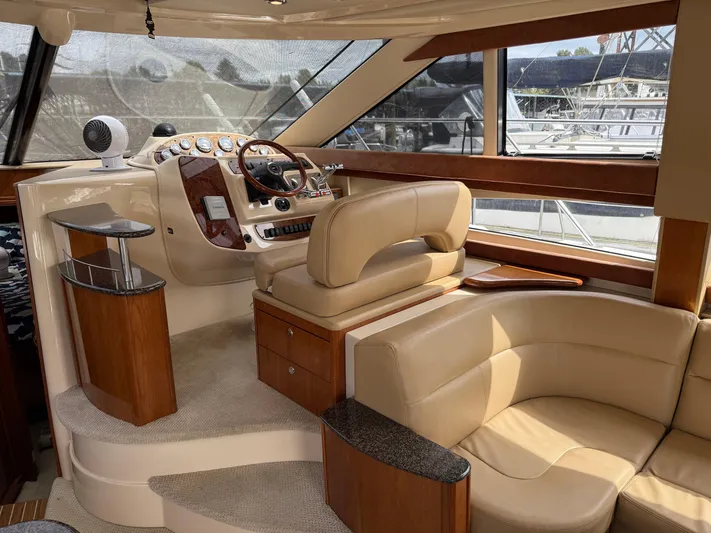  Yacht Photos Pics Luxurious interior of a 2006 Meridian 391 Sedan yacht with leather seating and wood accents.