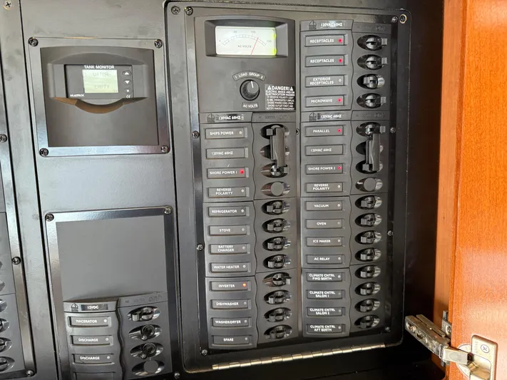  Yacht Photos Pics Electrical panel on a 2006 Meridian 391 Sedan boat, featuring labeled switches and gauges.