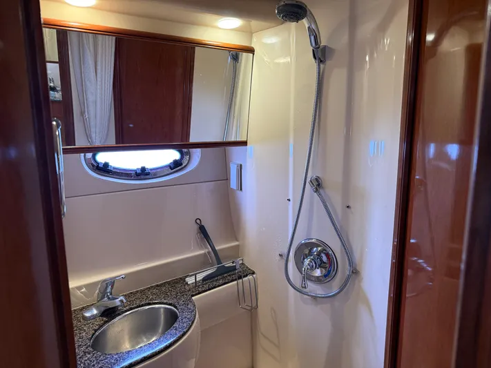  Yacht Photos Pics 2006 Meridian 391 Sedan yacht bathroom with shower, sink, and mirror.