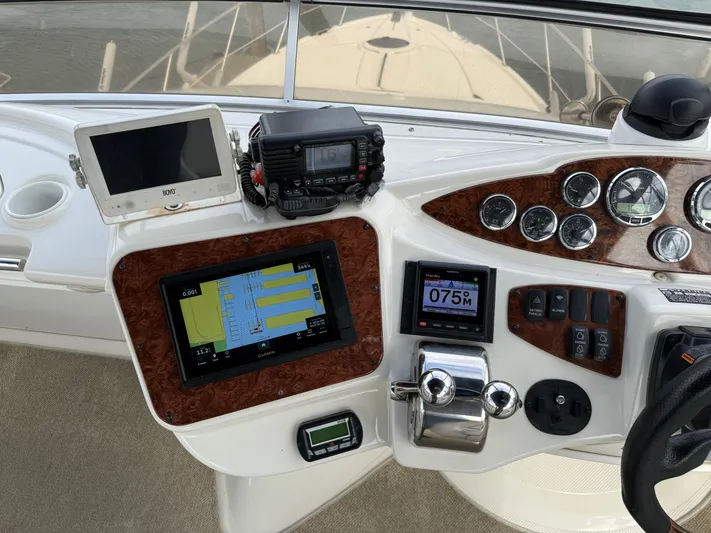  Yacht Photos Pics Control panel of a 2006 Meridian 391 Sedan boat with navigation and communication equipment.