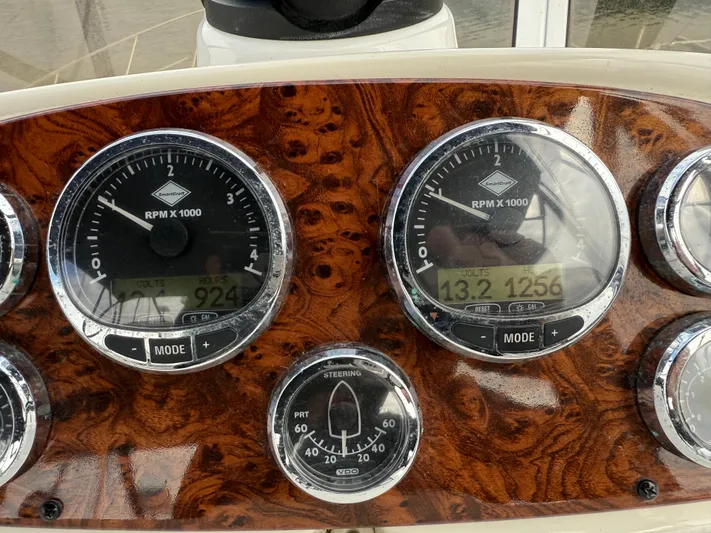  Yacht Photos Pics Dashboard of a 2006 Meridian 391 Sedan with RPM and steering gauges.