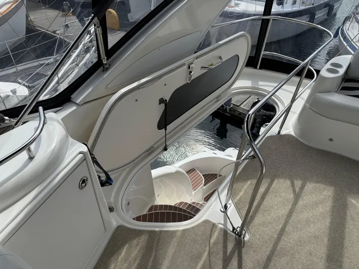  Yacht Photos Pics 2006 Meridian 391 Sedan yacht interior with open hatch and stairs, showcasing elegant design.