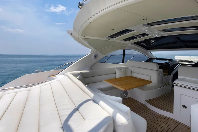  Yacht Photos Pics Luxurious 2017 Sunseeker San Remo yacht interior with white seating and ocean view.