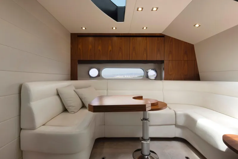  Yacht Photos Pics Luxurious interior of 2017 Sunseeker San Remo yacht with elegant seating and wooden accents.