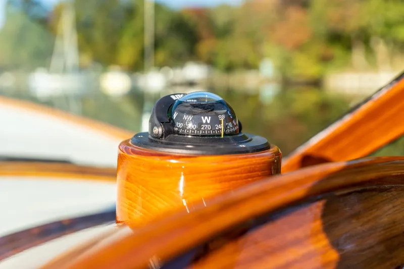 Blessed Yacht Photos Pics Compass on 2003 Hinckley Talaria 29 Runabout, showcasing polished wood finish.