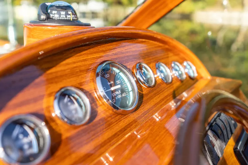 Blessed Yacht Photos Pics Dashboard of 2003 Hinckley Talaria 29 Runabout with wooden finish and gauges.