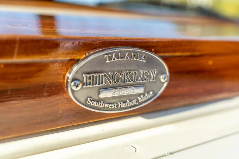 Blessed Yacht Photos Pics Hinckley Talaria 29 Runabout 2003 nameplate, Southwest Harbor, Maine, on polished wood surface.