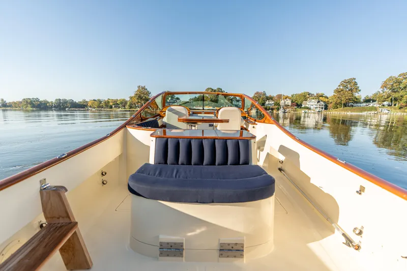 Blessed Yacht Photos Pics 2003 Hinckley Talaria 29 Runabout on calm water, featuring elegant seating and classic design.