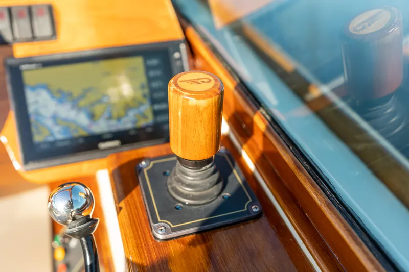 Blessed Yacht Photos Pics 2003 Hinckley Talaria 29 Runabout helm with navigation controls and wooden throttle.