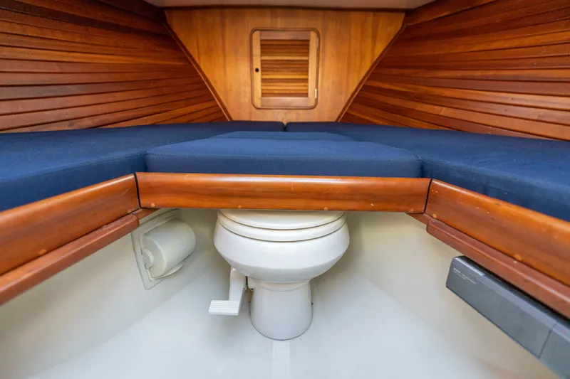 Blessed Yacht Photos Pics 2003 Hinckley Talaria 29 Runabout interior with wooden finish and marine toilet.