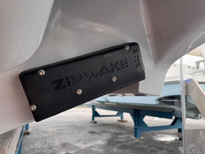Call Today! 32 #55 Yacht Photos Pics Zipwake trim system on a 2025 Solace 32 CS boat hull.