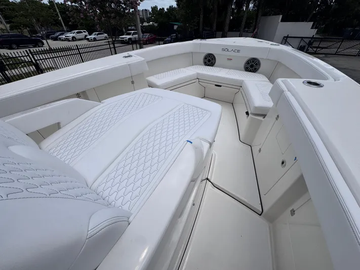 Call Today! 32 #55 Yacht Photos Pics 2025 Solace 32 CS boat interior with white seating and modern design.