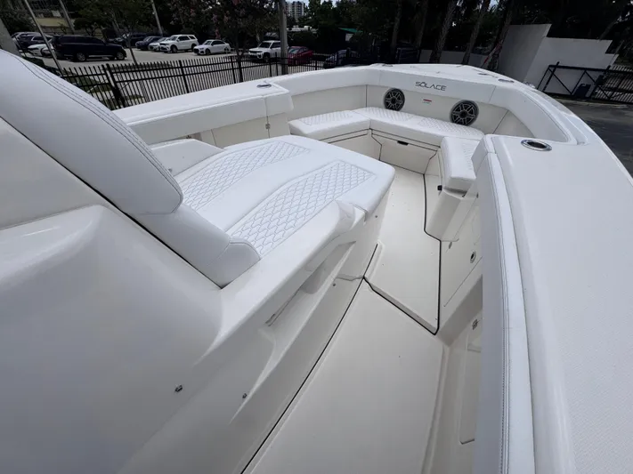 Call Today! 32 #55 Yacht Photos Pics 2025 Solace 32 CS boat interior with white seating and modern design.