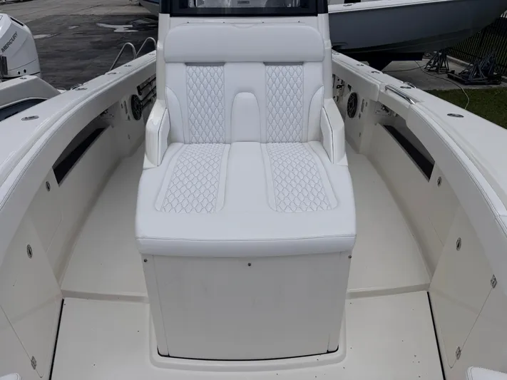 Call Today! 32 #55 Yacht Photos Pics Luxurious seating on 2025 Solace 32 CS boat, featuring elegant white upholstery.