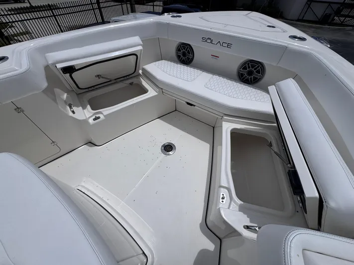 Call Today! 32 #55 Yacht Photos Pics 2025 Solace 32 CS boat interior with storage compartments and seating.