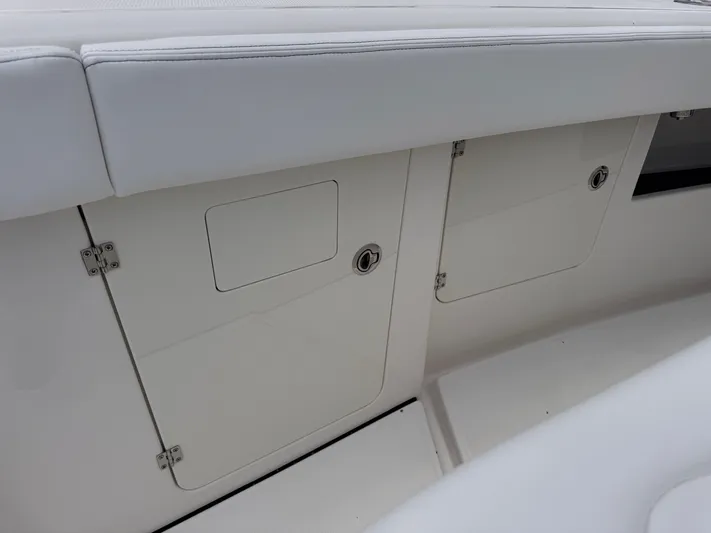 Call Today! 32 #55 Yacht Photos Pics 2025 Solace 32 CS boat storage compartments with sleek white finish.