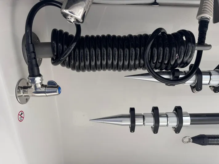 Call Today! 32 #55 Yacht Photos Pics Coiled hose and metal fixtures on 2025 Solace 32 CS boat.