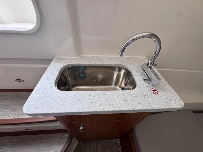 Call Today! 32 #55 Yacht Photos Pics 2025 Solace 32 CS boat sink with modern faucet and granite countertop.