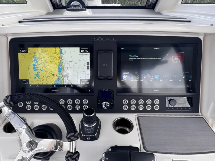 Call Today! 32 #55 Yacht Photos Pics Dashboard of 2025 Solace 32 CS boat with dual navigation screens and controls.