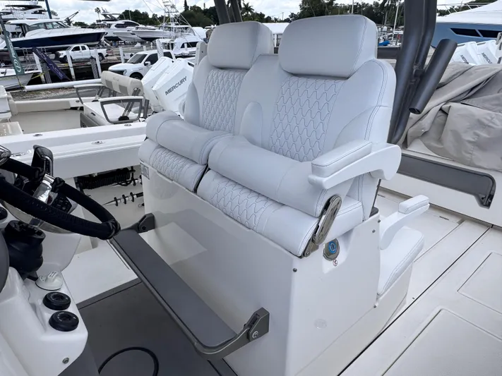 Call Today! 32 #55 Yacht Photos Pics Luxury seating on 2025 Solace 32 CS boat, featuring plush white upholstery and modern design.