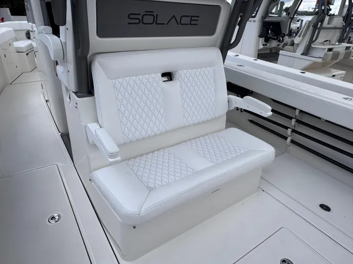 Call Today! 32 #55 Yacht Photos Pics Luxurious seating on 2025 Solace 32 CS boat with elegant white upholstery.