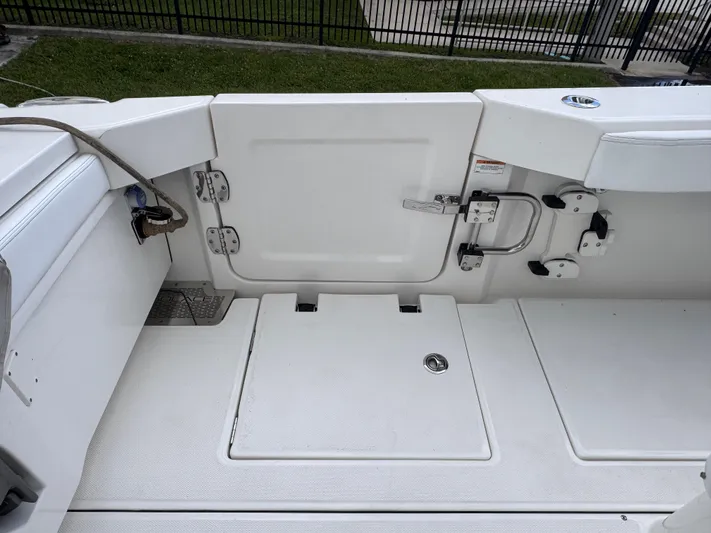 Call Today! 32 #55 Yacht Photos Pics 2025 Solace 32 CS boat deck with storage compartments and safety features.