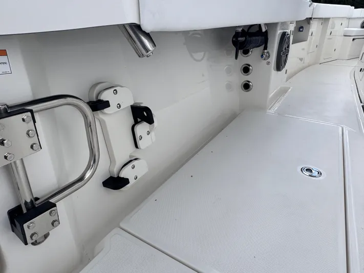 Call Today! 32 #55 Yacht Photos Pics Interior view of 2025 Solace 32 CS boat, featuring sleek white deck and stainless steel fittings.