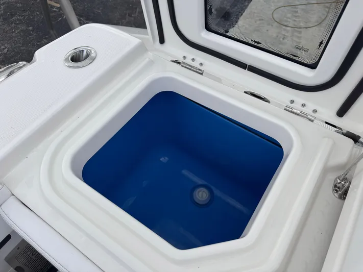 Call Today! 32 #55 Yacht Photos Pics Livewell compartment on a 2025 Solace 32 CS boat, featuring a blue interior.