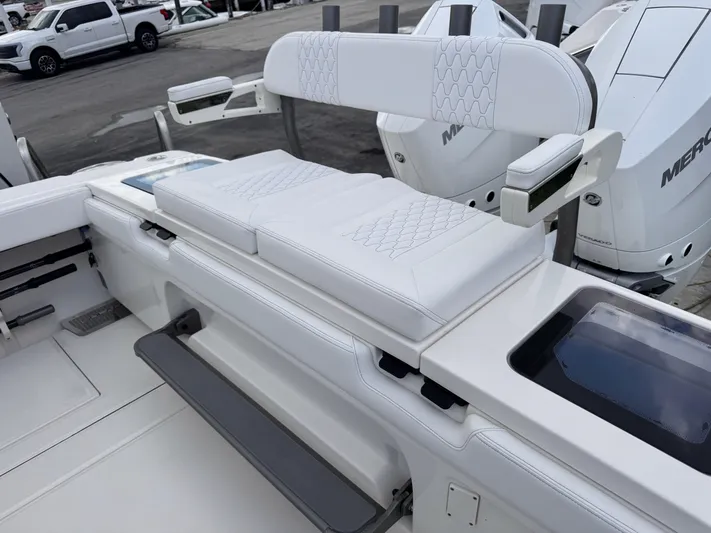 Call Today! 32 #55 Yacht Photos Pics 2025 Solace 32 CS boat interior with white cushioned seating and modern design.